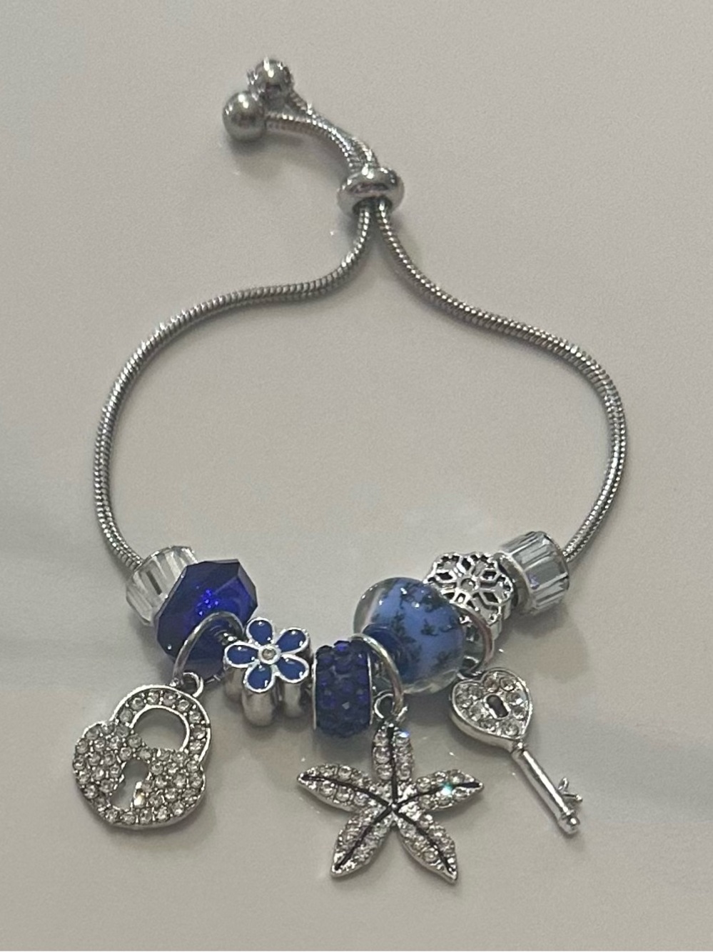 Silver-Tone Blue Charm Bracelet with Starfish and Key Charms
